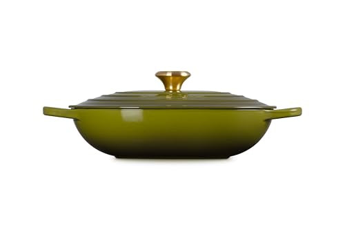 Serving-ready Le Creuset olive oval casserole displayed at the table.