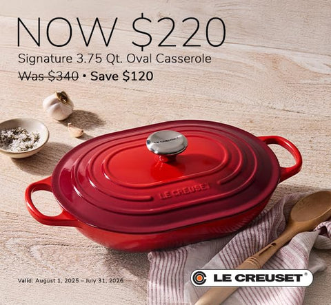 Oven-safe Le Creuset Marseille oval casserole warm on table after cooking.