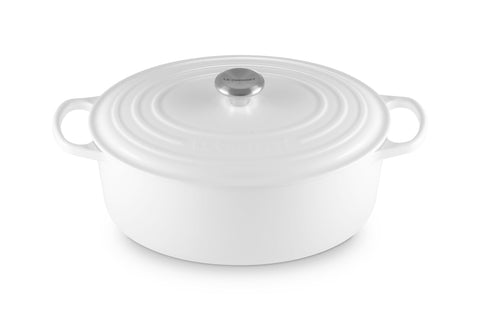 Le Creuset Signature oval Dutch oven 8qt white, ideal for stove-to-table cooking.