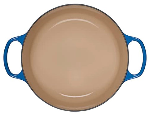 Le Creuset Signature Round Dutch Oven stovetop searing enables even browning.