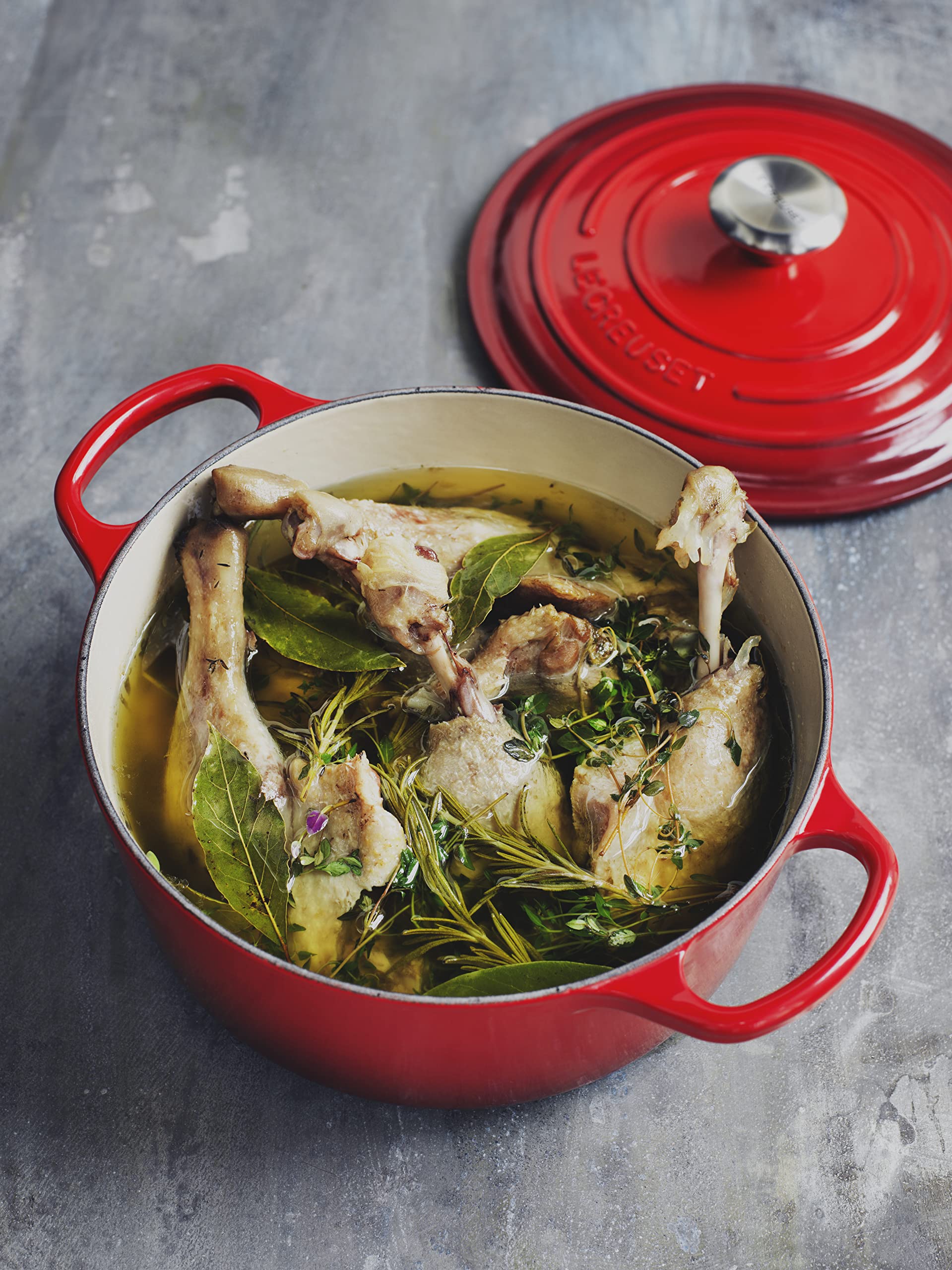 Le Creuset on dining table, durable enamel finish