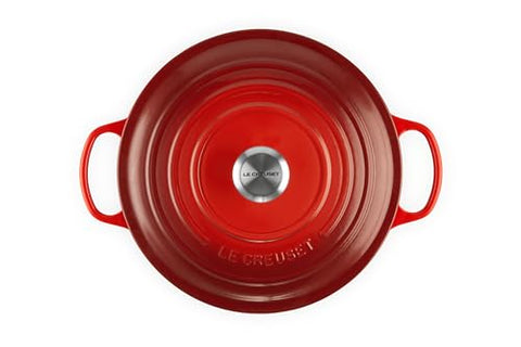 Le Creuset cerise dutch oven with lid on for steam circulation