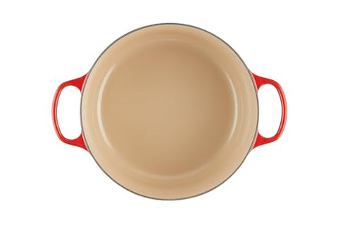 Le Creuset cerise dutch oven on stove, ideal for slow cooking