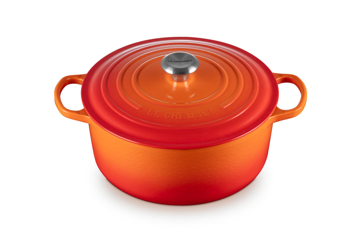 Le Creuset Signature 7.25 qt Dutch oven exterior in Flame preserves heat for even cooking.