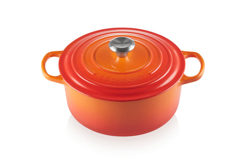 Le Creuset Signature Dutch Oven in Flame color showing vibrant exterior and heat retention