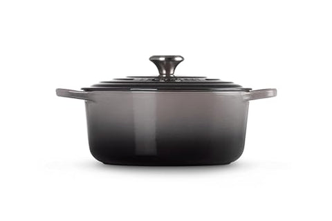 Le Creuset braising scene illustrates slow-cooked meals and tender textures.