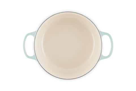 Interior enamel of Le Creuset Signature Round Dutch Oven Sea Salt for easy monitoring.