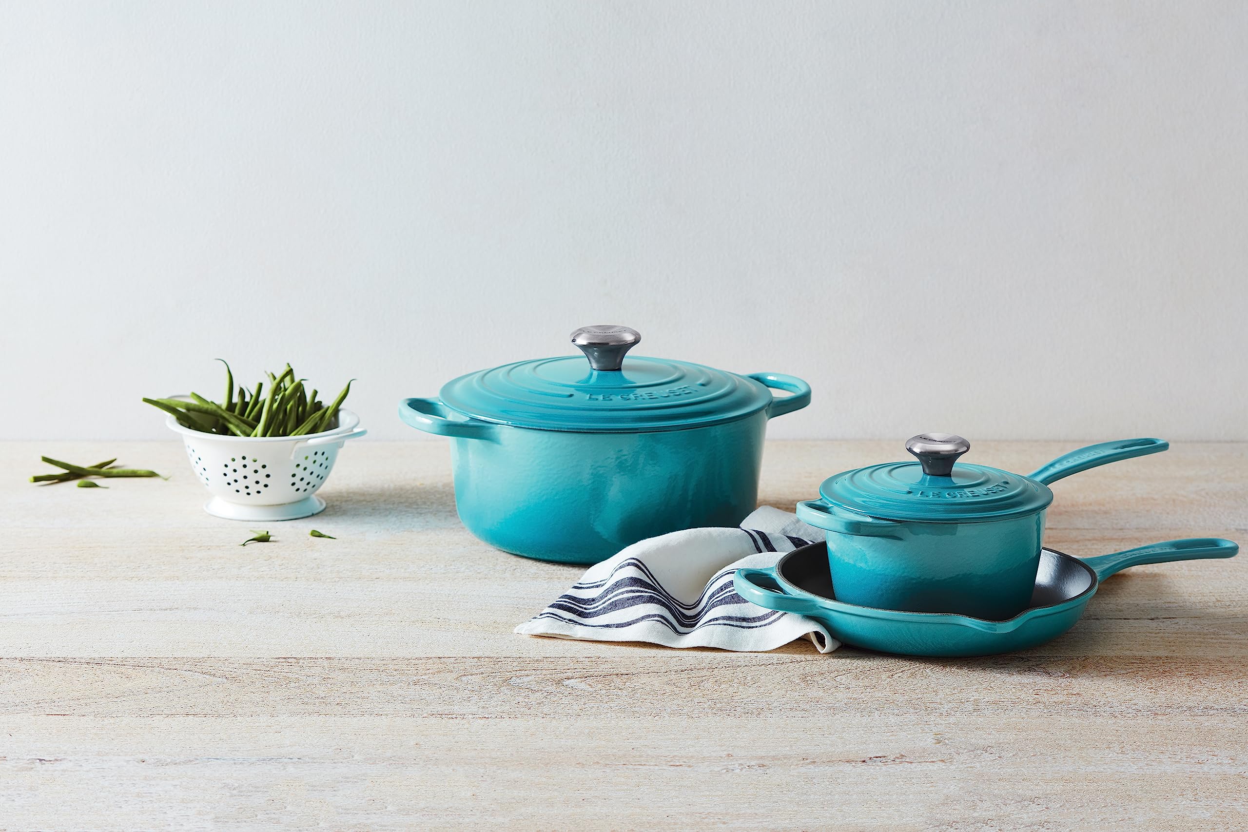 Le Creuset Signature saucepan simmering sauce with even heat.