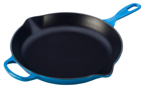 Le Creuset Signature skillet in Marseille 11.75-inch, showcasing enameled interior for easy cleaning