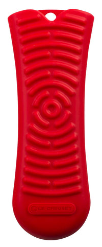 Le Creuset Cerise silicone cool tool handle sleeve provides secure grip on hot cookware