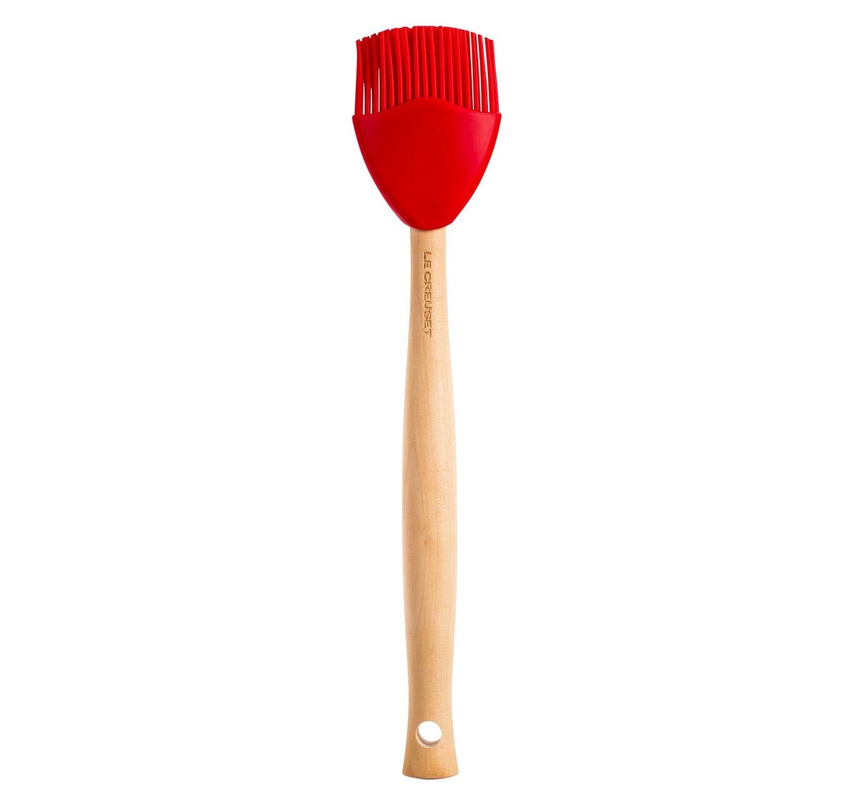 Le Creuset silicone craft basting brush in cerise with ergonomic handle for steady basting