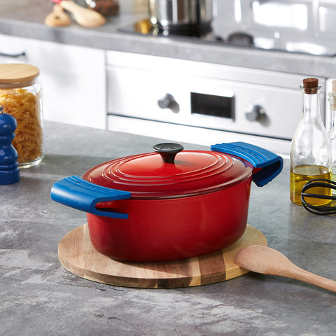Sturdy Le Creuset grips keep pans easier to maneuver in the oven.