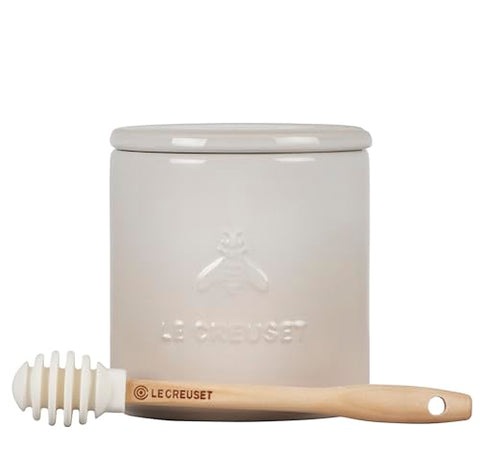 Le Creuset silicone honey dipper included for mess-free honey application.