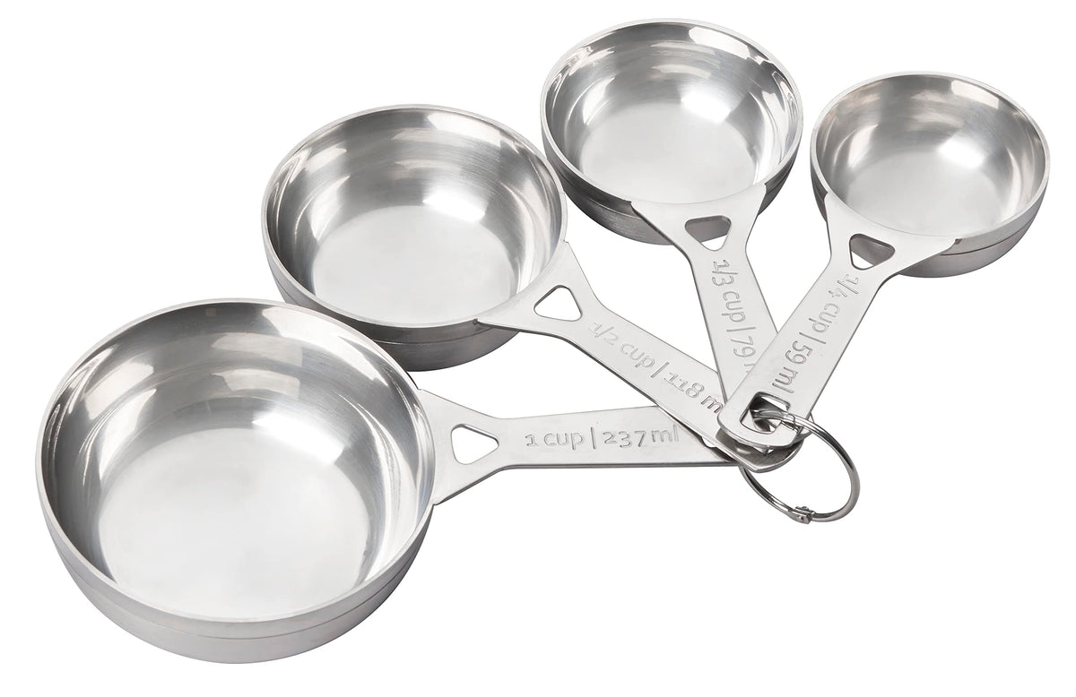 Le Creuset stainless steel measuring cups set arranged for quick ingredient prep