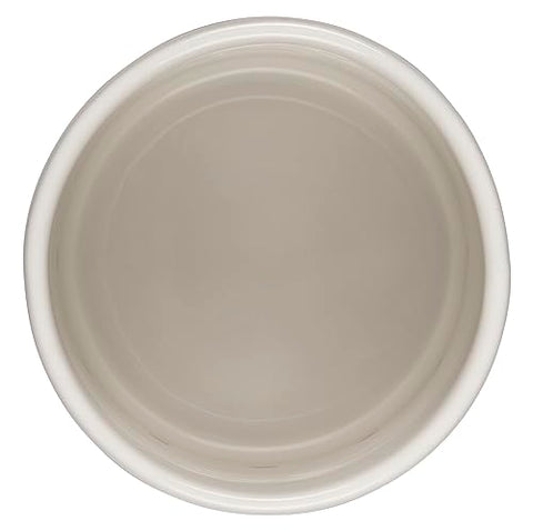 Le Creuset stoneware close-up, dense material blocks moisture for storage.