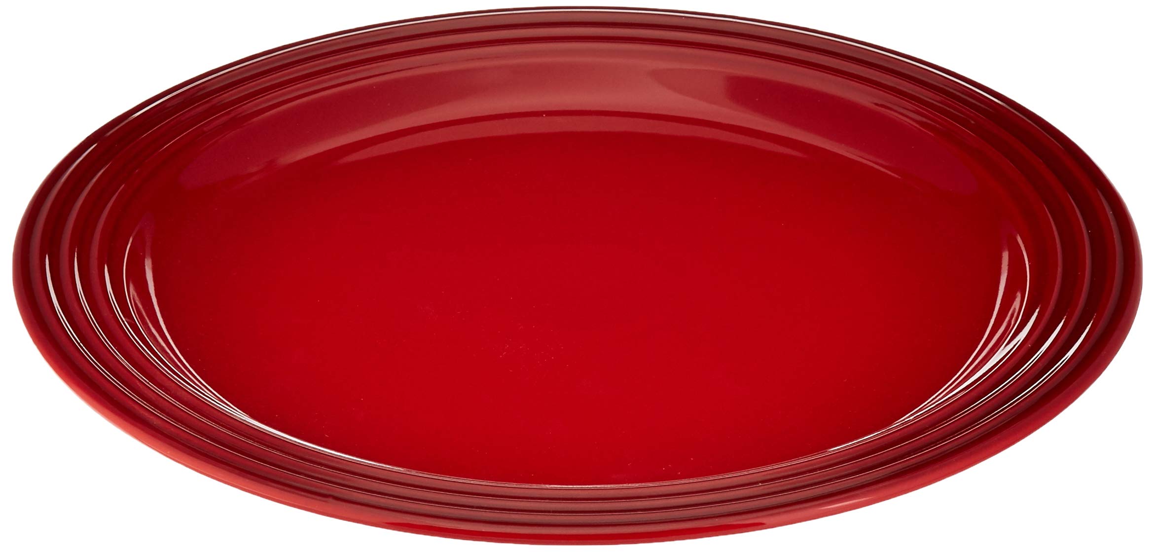 Le Creuset stoneware dinner plate resists chips and stains for daily use