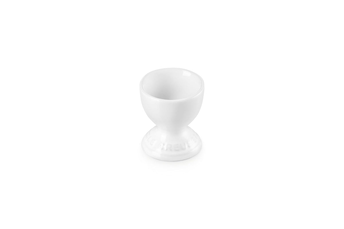 Le Creuset stoneware egg cup in white for elegant serving.