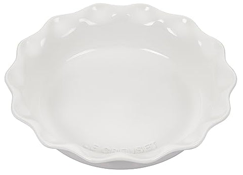 Le Creuset stoneware glaze close-up in white shows scratch resistance and non-porous surface.