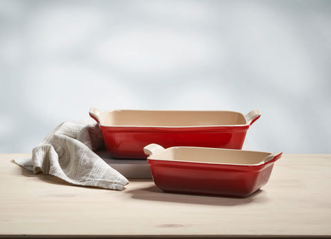 Le Creuset Heritage rectangular dish in Cerise, handle close-up for easy carrying.