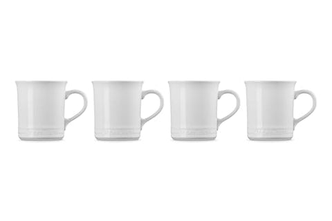 Le Creuset stoneware mugs 4 white detailed glaze close-up emphasizes durability and color.