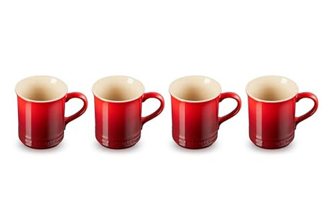 Le Creuset Cerise mugs stacked together highlight compact storage and cohesive tableware