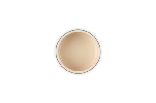 Le Creuset stoneware ramekin on table for individual servings and stylish dining.