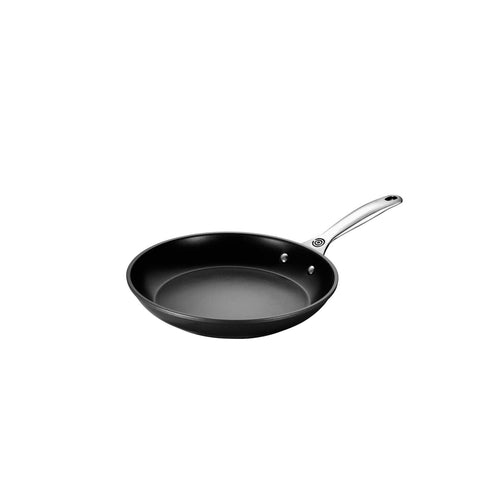 Le Creuset pan with metal utensil compatibility for versatile use