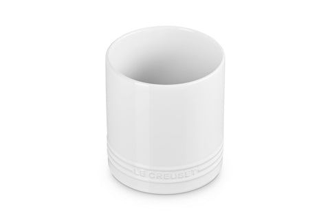 Le Creuset utensil crock with straight walls keeps tools organized on the counter.