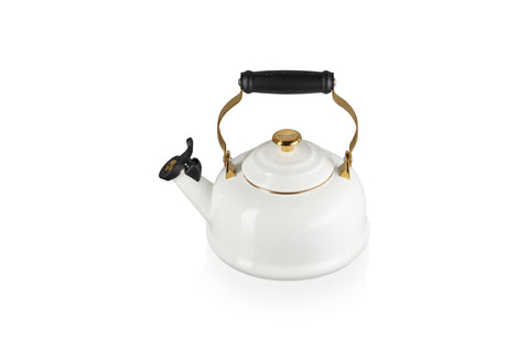 Le Creuset white enamel whistling kettle with gold knob for quick boiling