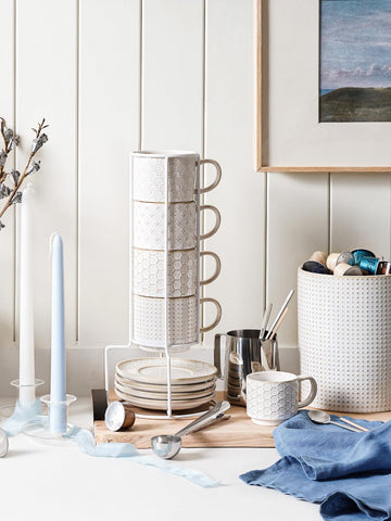 LE TAUCI metal stand with silicone feet protects surfaces while stacking.