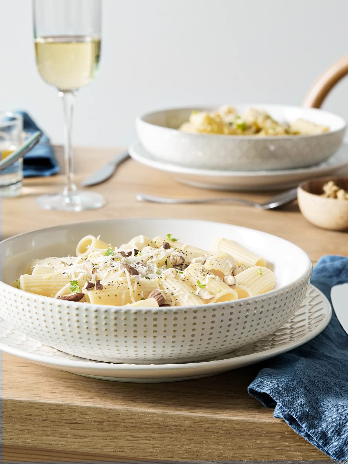 LE TAUCI embossed exterior pattern adds timeless texture to gatherings.