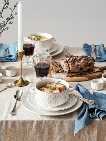 LE TAUCI embossed patterns closeup adds elegant detail to dining.