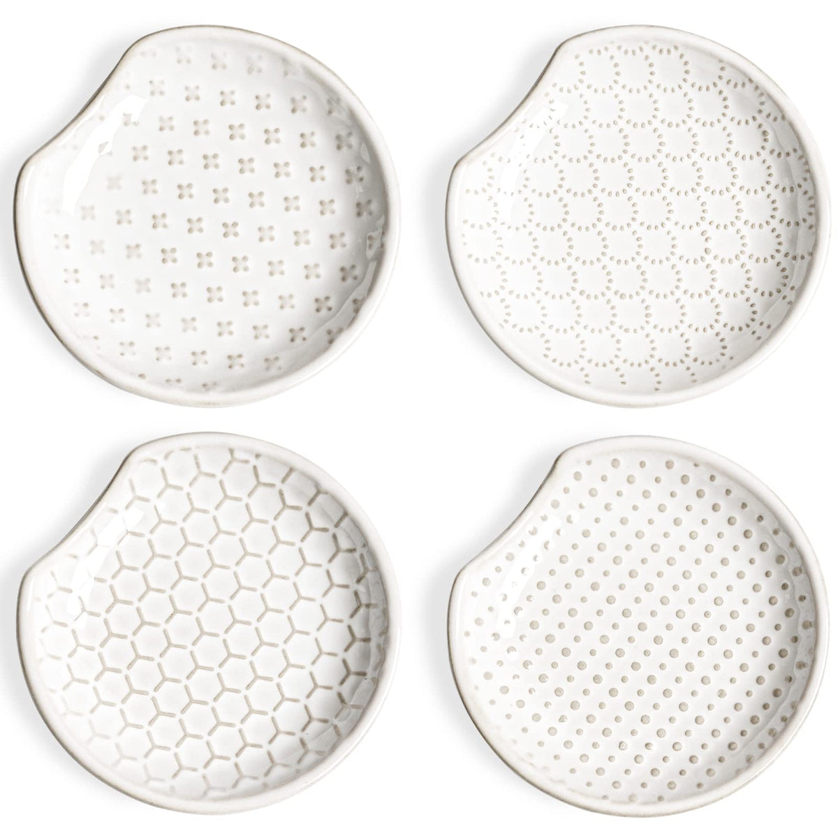 LE TAUCI spoon rest with embossed flower design sits on the stovetop to catch drips