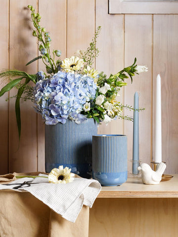 LE TAUCI utensil holder on countertop provides easy access.