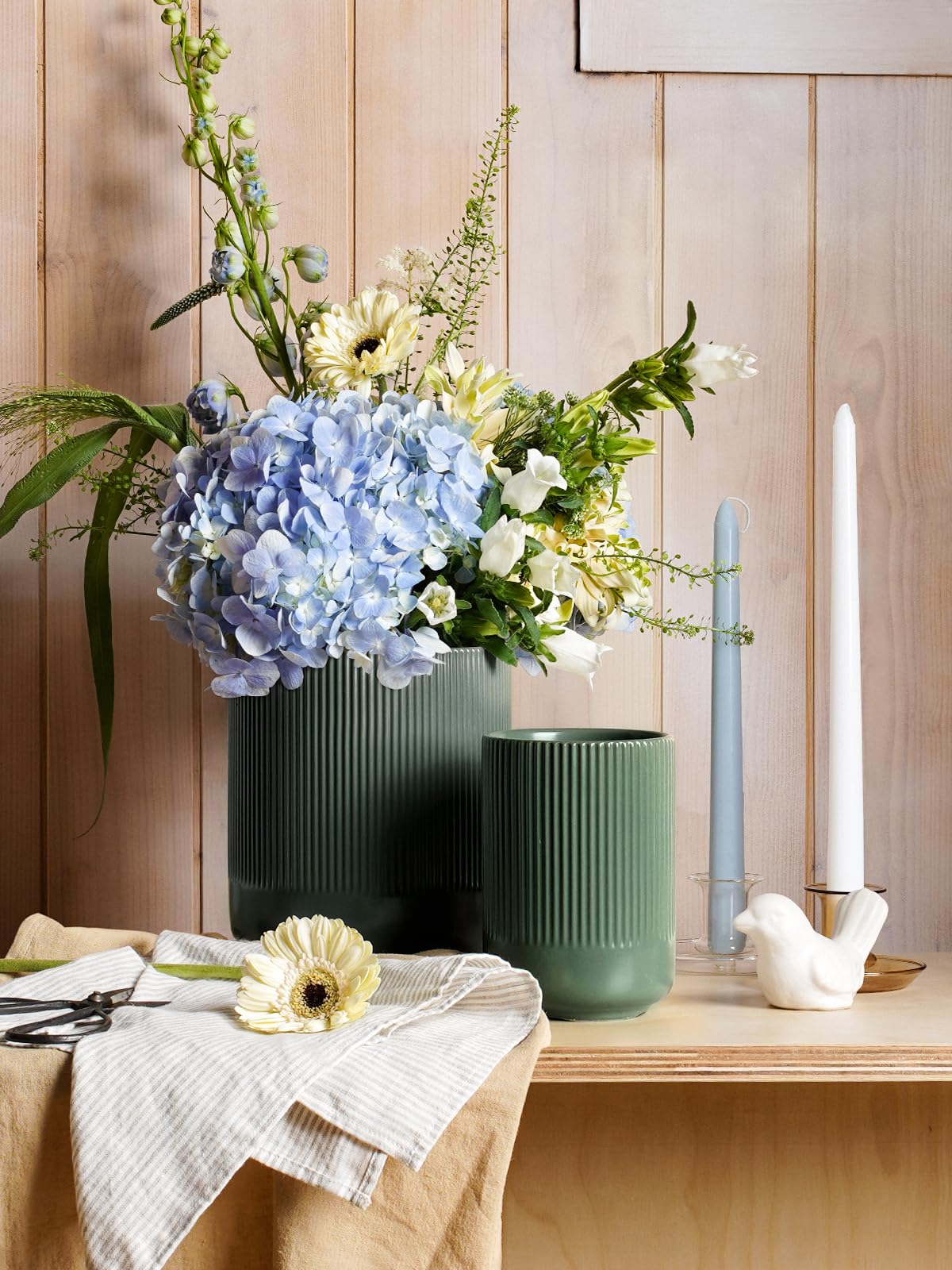 LE TAUCI vase use demonstrates versatile styling for hair tools or flowers.