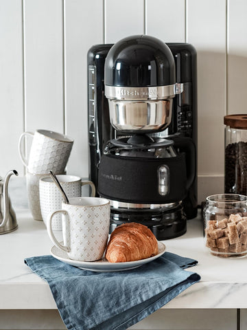 LE TAUCI embossed mugs with clean white interior for color viewing