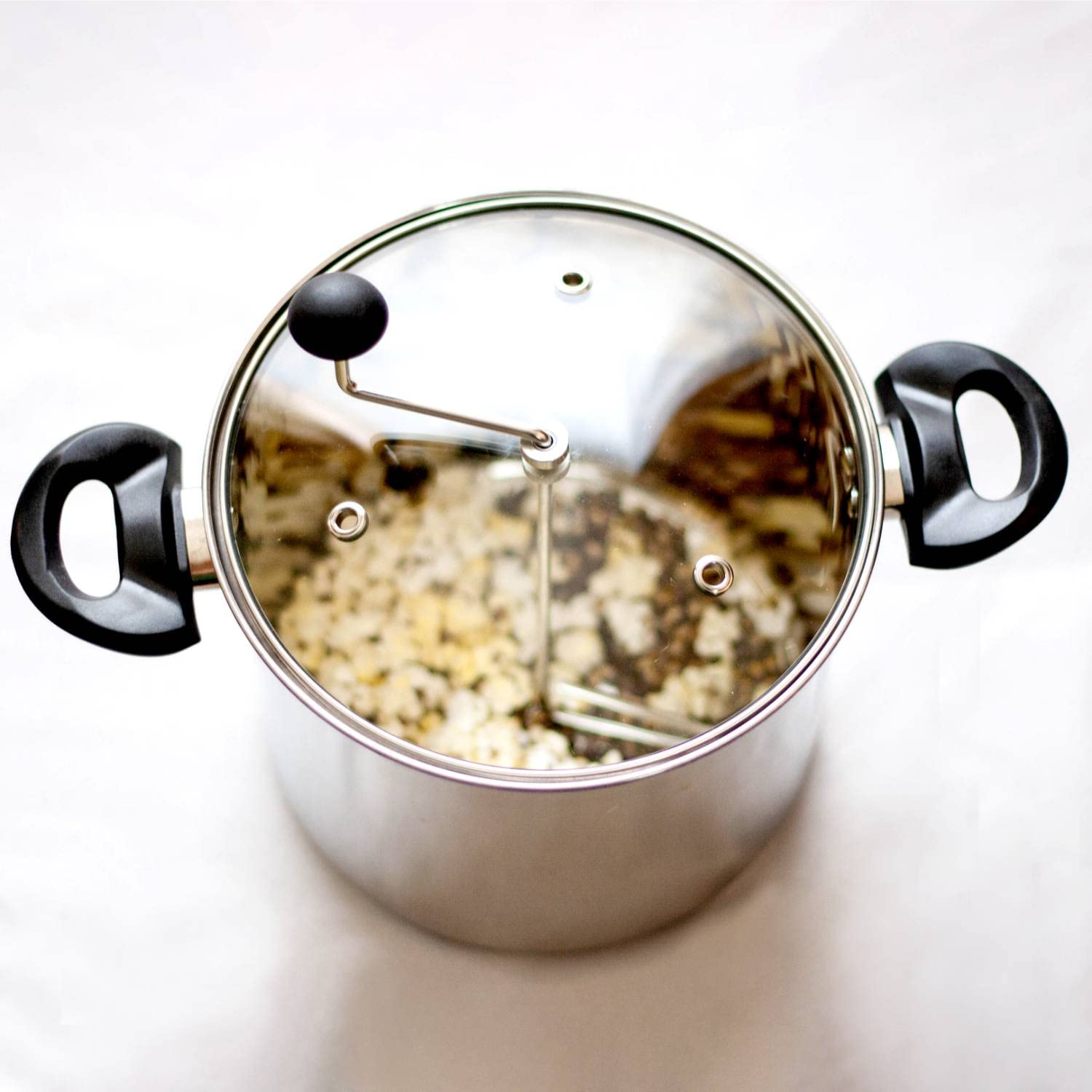 Lehman's stovetop popper stirring rod close-up shows even heat distribution