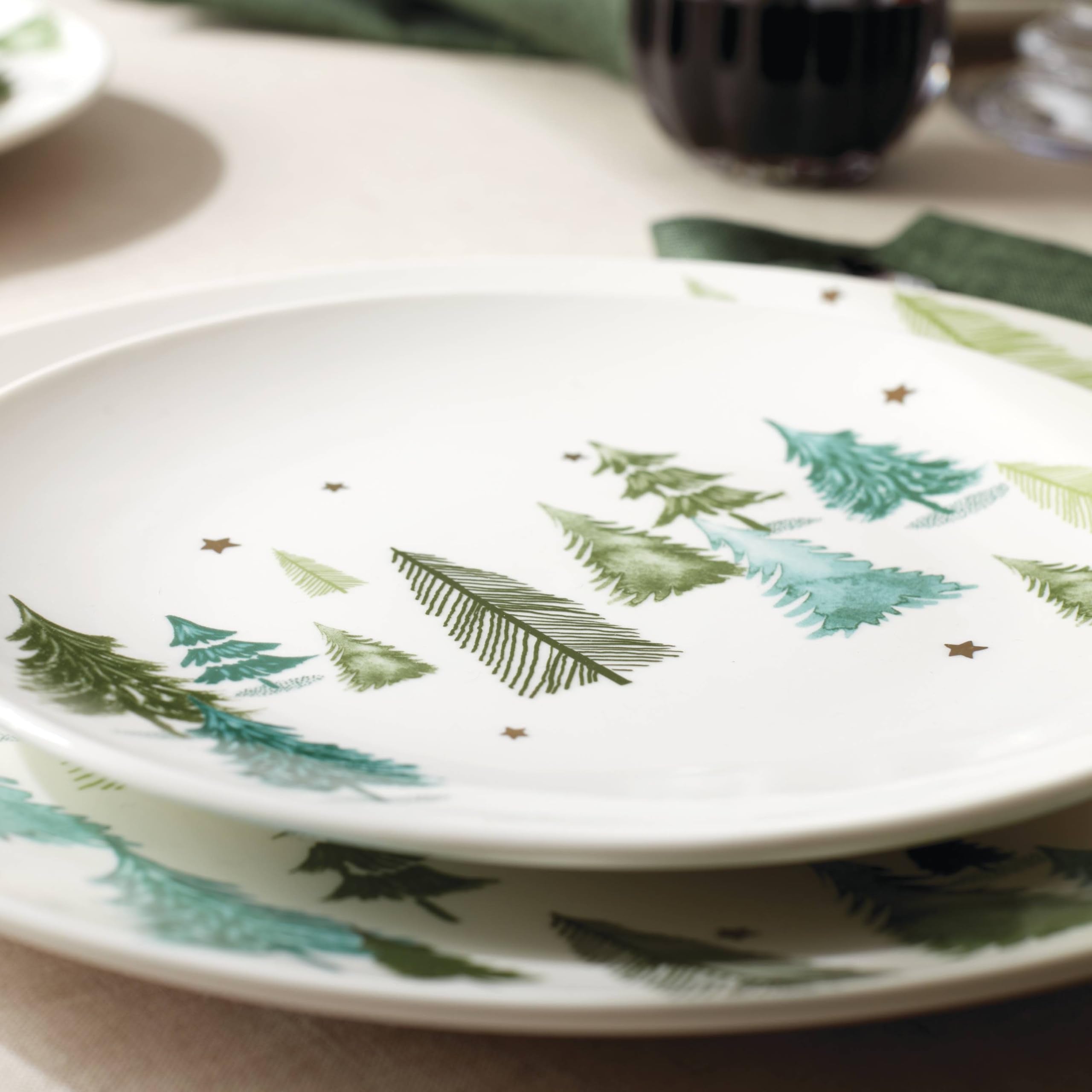 Lenox Balsam Lane plate paired with red napkins for festive settings.