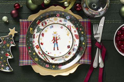 Lenox porcelain salad plate with Nutcracker motif and gold edge.