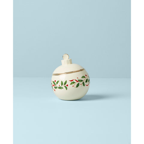 Lenox holly-motif candy jar showcases elegance at family dinners and gifting.