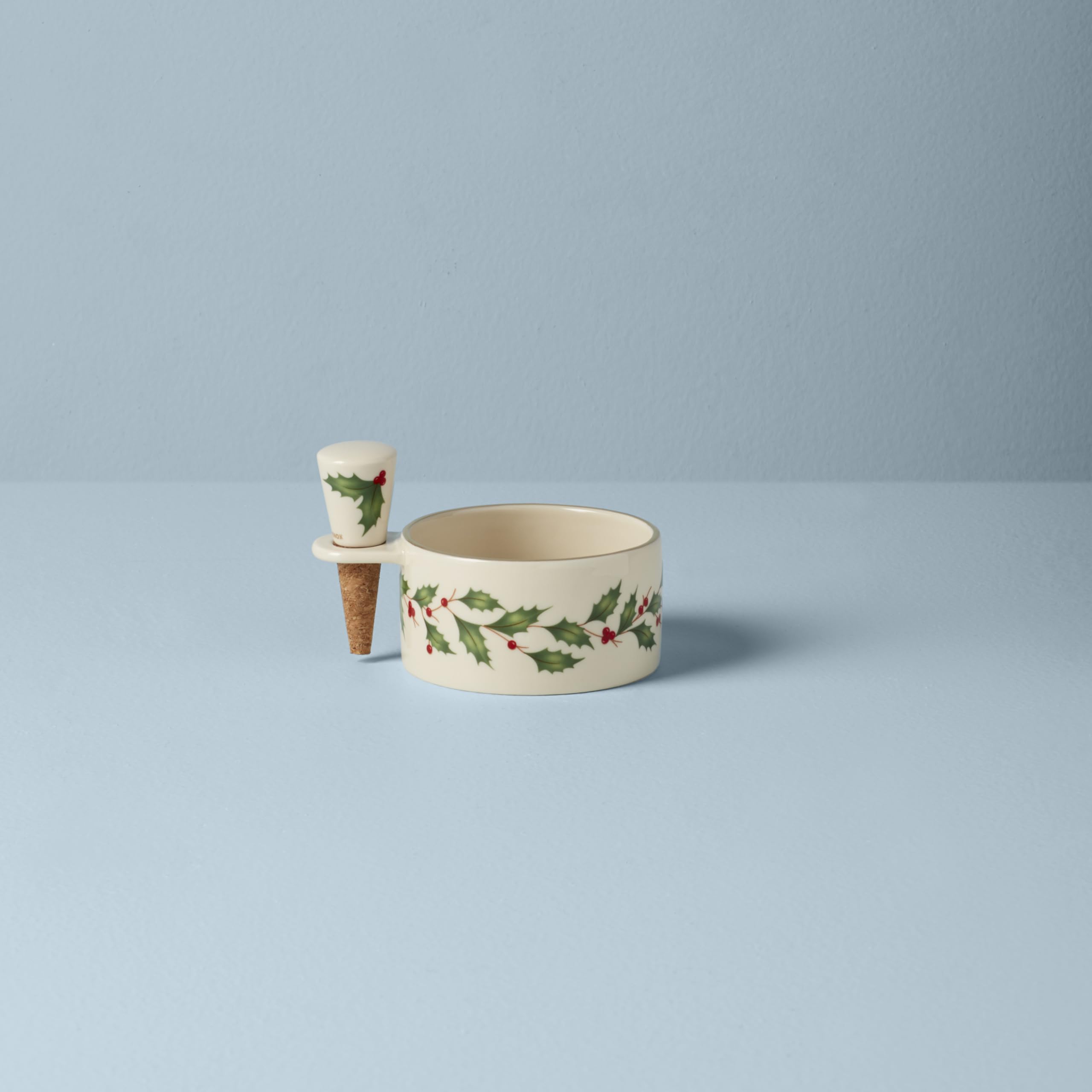 Lenox stopper set resting cork with wine bottle on base for mess-free serving.