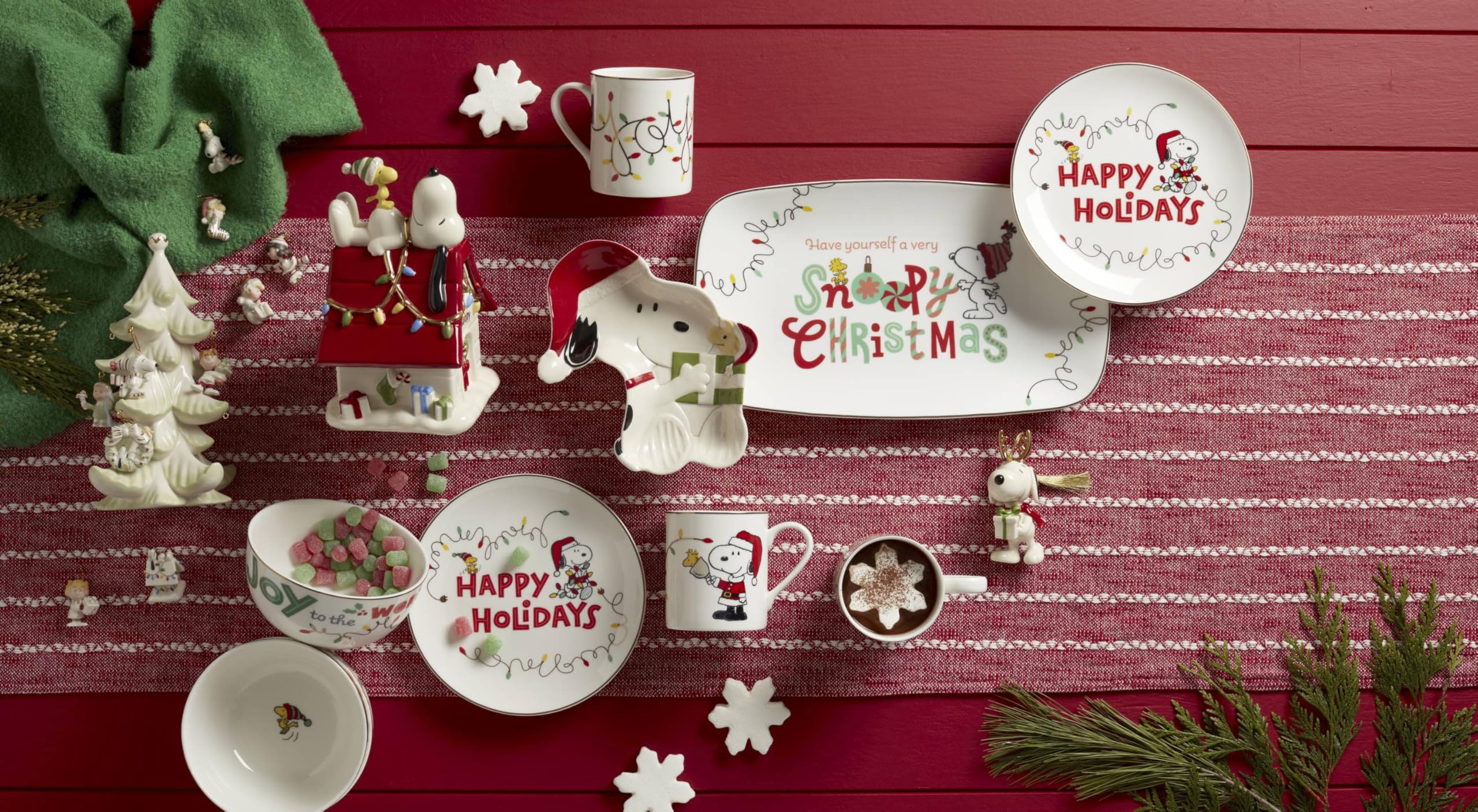 Lenox Snoopy candy dish on a decorated holiday table for snacks.
