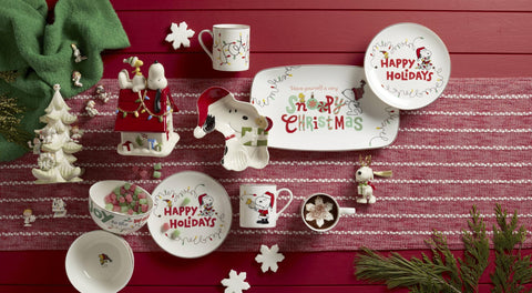 Lenox Snoopy candy dish on a decorated holiday table for snacks.