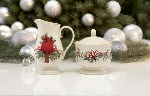 Red cardinal motif enhances the creamer for festive occasions