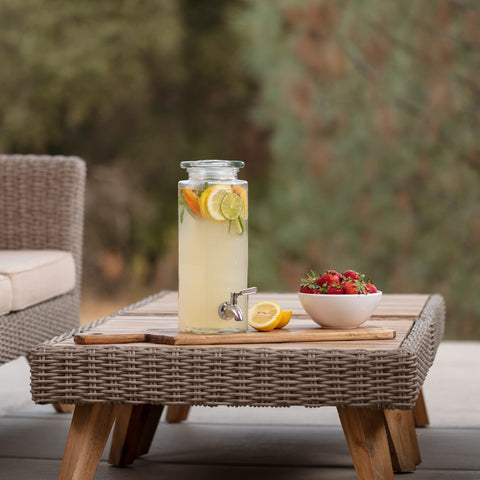 Decorative glass dispenser on a party table enhancing decor.