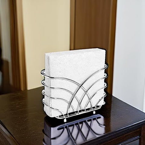 Napkin holder placed on a dining counter with silver tone