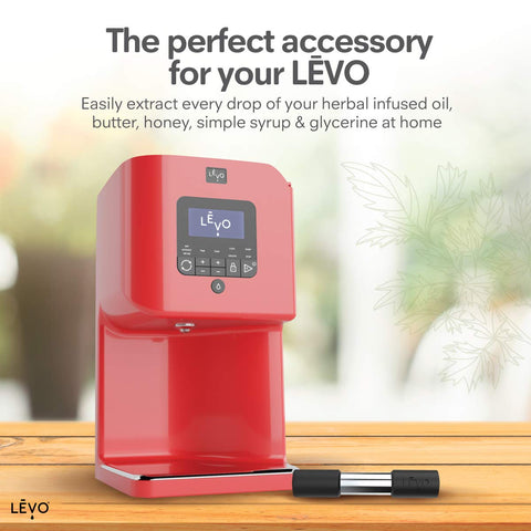 LEVO Herb Press in use, extracting oil from herbs.