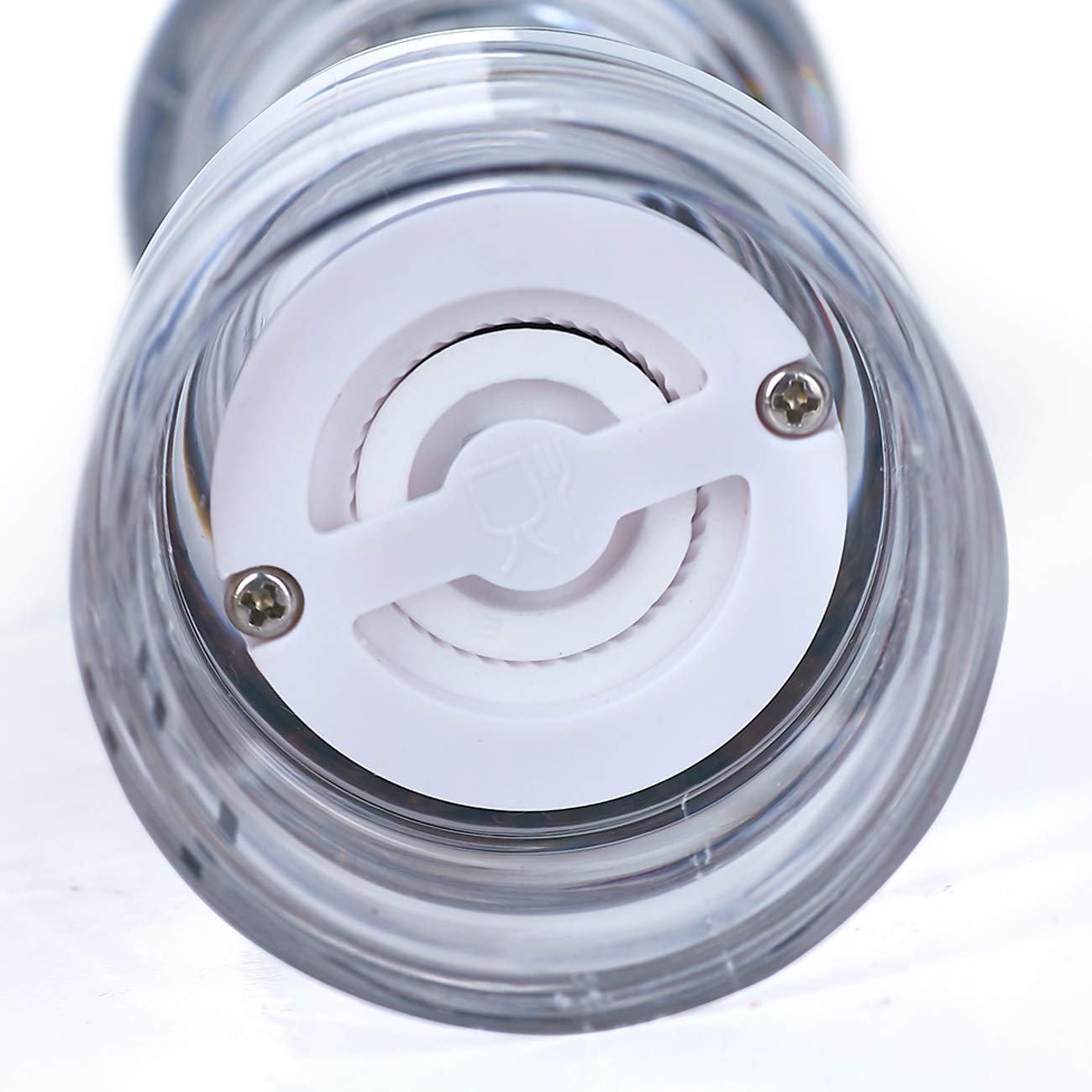 LHS salt shaker clear acrylic body shows remaining salt