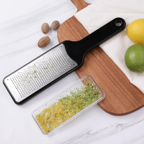 LHS Transparent container catches grated ingredients for tidy prep.