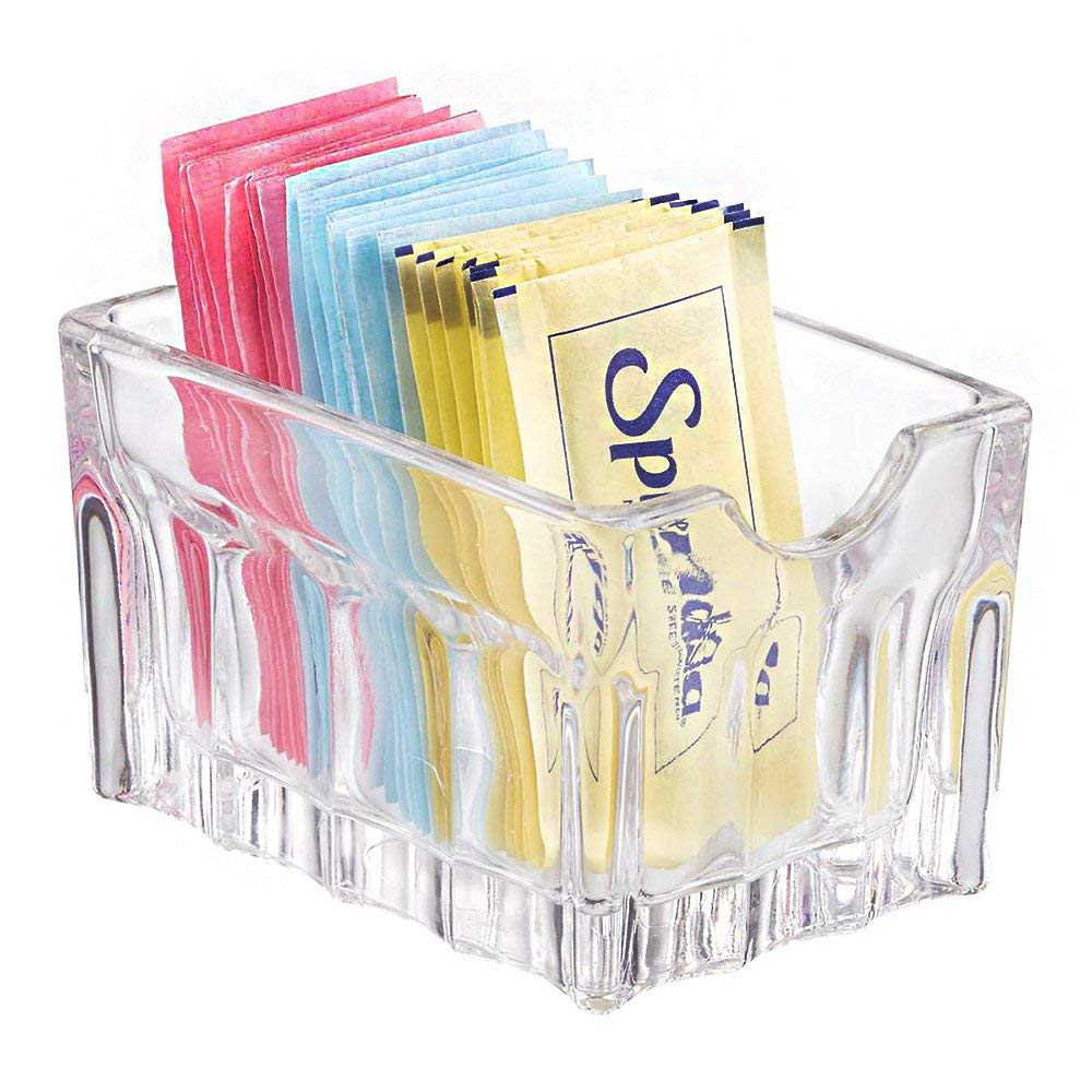 Libbey clear sugar packet holder on a table for easy sugar access in coffee service
